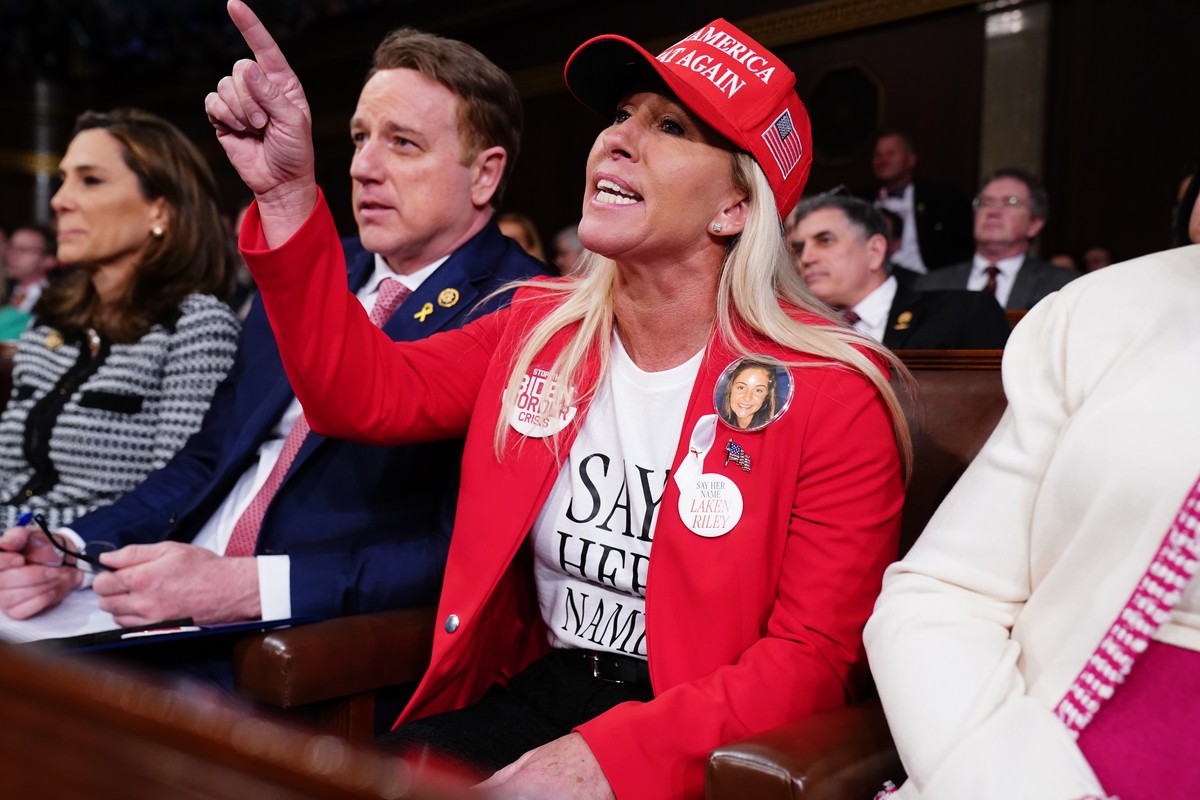 epaselect epa11205895 Republican Representative from Georgia Marjorie Taylor shouts at US President Joe Biden as he delivers his third State of the Union address in the House Chamber of the US Capitol ...