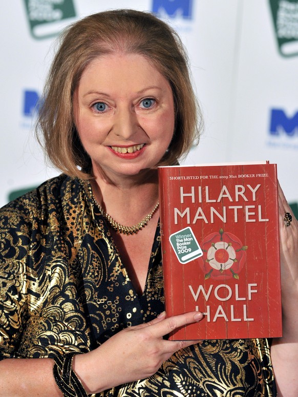 epa10201034 (FILE) - Winner of the 2009 Man Booker Prize, British novelist Hilary Mantel, poses for photographers with her book 'Wolf Hall' after the winner announcement held at Guildhall in ...