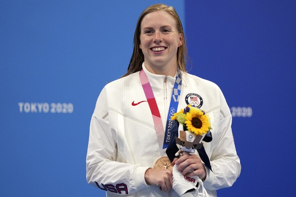 Lilly King of the United States poses with her bronze medal after the final of the women&#039;s 100-meter breaststroke at the 2020 Summer Olympics, Tuesday, July 27, 2021, in Tokyo, Japan. (AP Photo/M ...