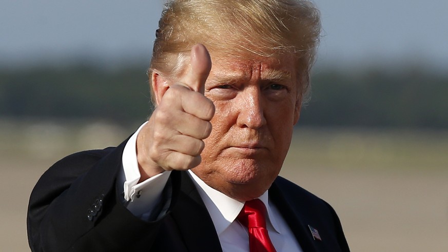 President Donald Trump gives thumbs up as he steps off Air Force One as he arrives Monday, Oct. 8, 2018, at Andrews Air Force Base, Md. Trump is returning from Orlando, Fla. Forget “Obamacare.” Presid ...