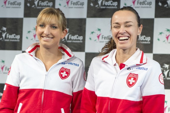 Swiss tennis players Timea Bacsinszky, left, and Martina Hingis, right, at the draw ceremony of the World Group Semifinal Fed Cup, in Lucerne, Switzeland, Friday, April 15, 2016. The Swiss Fed Cup Tea ...