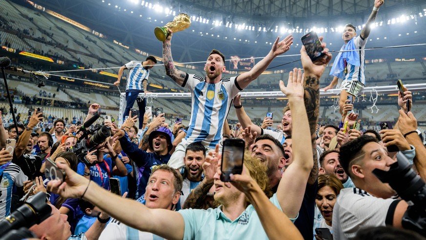 221218 Lionel Messi of Argentina celebrates with the FIFA World Cup, WM, Weltmeisterschaft, Fussball Trophy after winning the FIFA World Cup 2022 final between Argentina and France on December 18, 202 ...