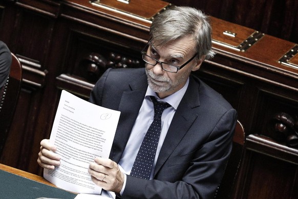 epa05423002 Italian Transport Minister Graziano Delrio prepares to deliver a statement on the fatal Puglia train collision, at the Chamber of Deputies (parliament), in Rome, Italy, 13 July 2016. The d ...