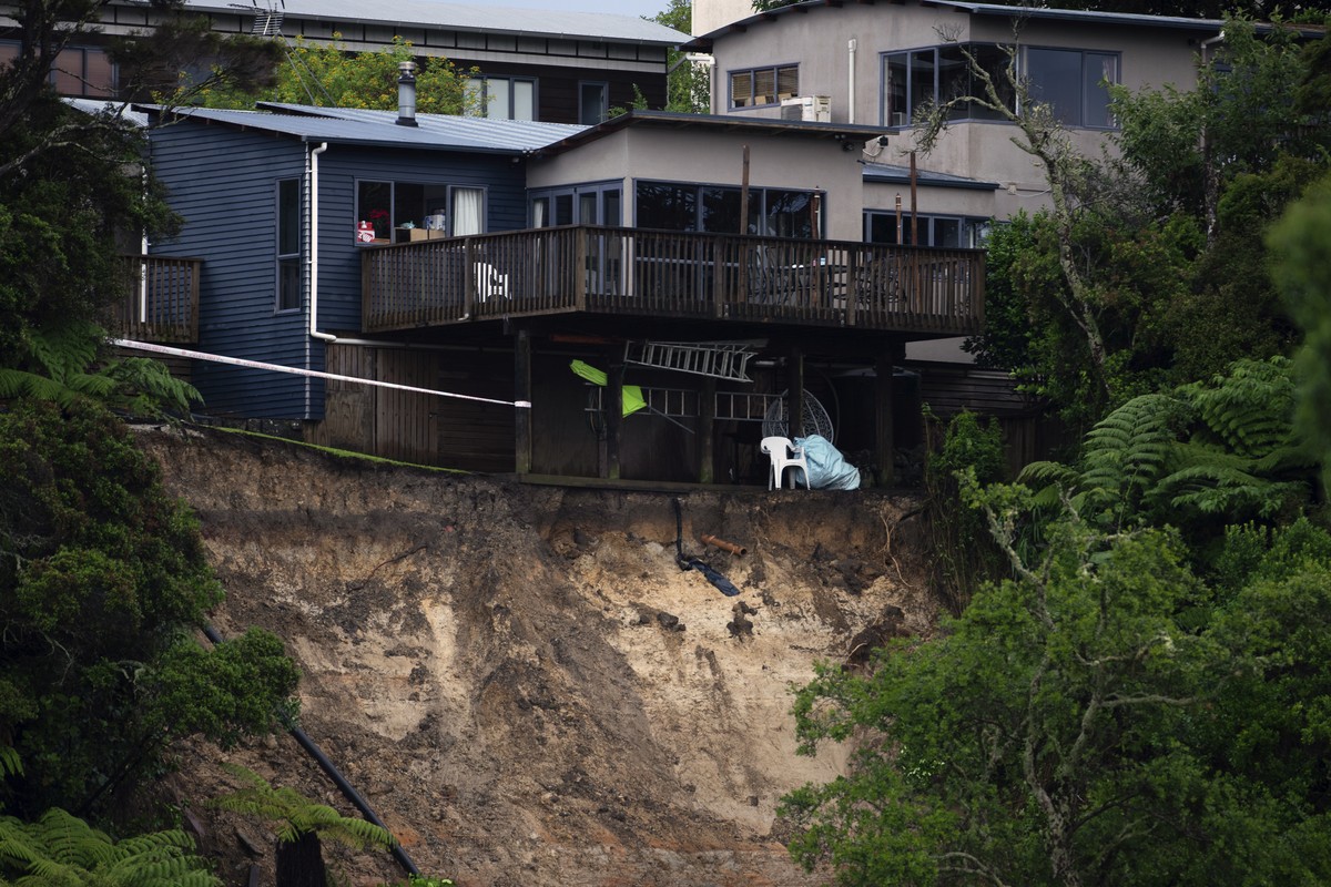 A landslip caused by flood water undermines a house in Auckland, Saturday, Jan. 28, 2023. Record levels of rainfall pounded New Zealand's largest city, causing widespread disruption. (Hadyen Wood ...