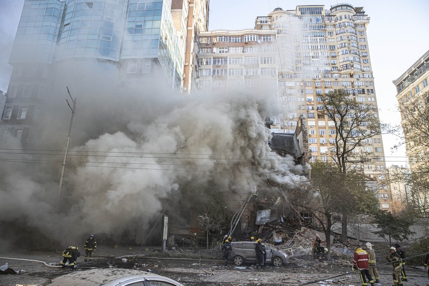 KYIV, UKRAINE - OCTOBER 17: Firefighters conduct work in a destroyed building after Russian attacks in Kyiv, Ukraine on October 17, 2022. It was reported that two separate explosions occurred in Kyiv  ...
