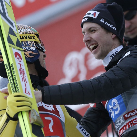 Japan&#039;s Noriaki Kasai, left, celebrates after his second jump with Switzerland&#039;s Simon Ammann at the third stage of the four hills ski jumping tournament in Innsbruck, Austria, Sunday, Jan.  ...