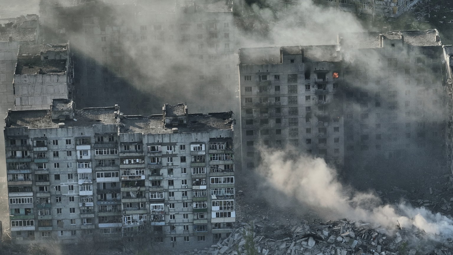 Smoke rises from buildings in this aerial view of Bakhmut, in the Donetsk region, Ukraine, Wednesday, April 26, 2023. (AP Photo/Libkos)