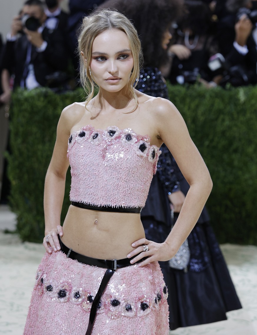epa09466879 Lily-Rose Depp poses on the red carpet for the 2021 Met Gala, the annual benefit for the Metropolitan Museum of Art&#039;s Costume Institute, in New York, New York, USA, 13 September 2021. ...