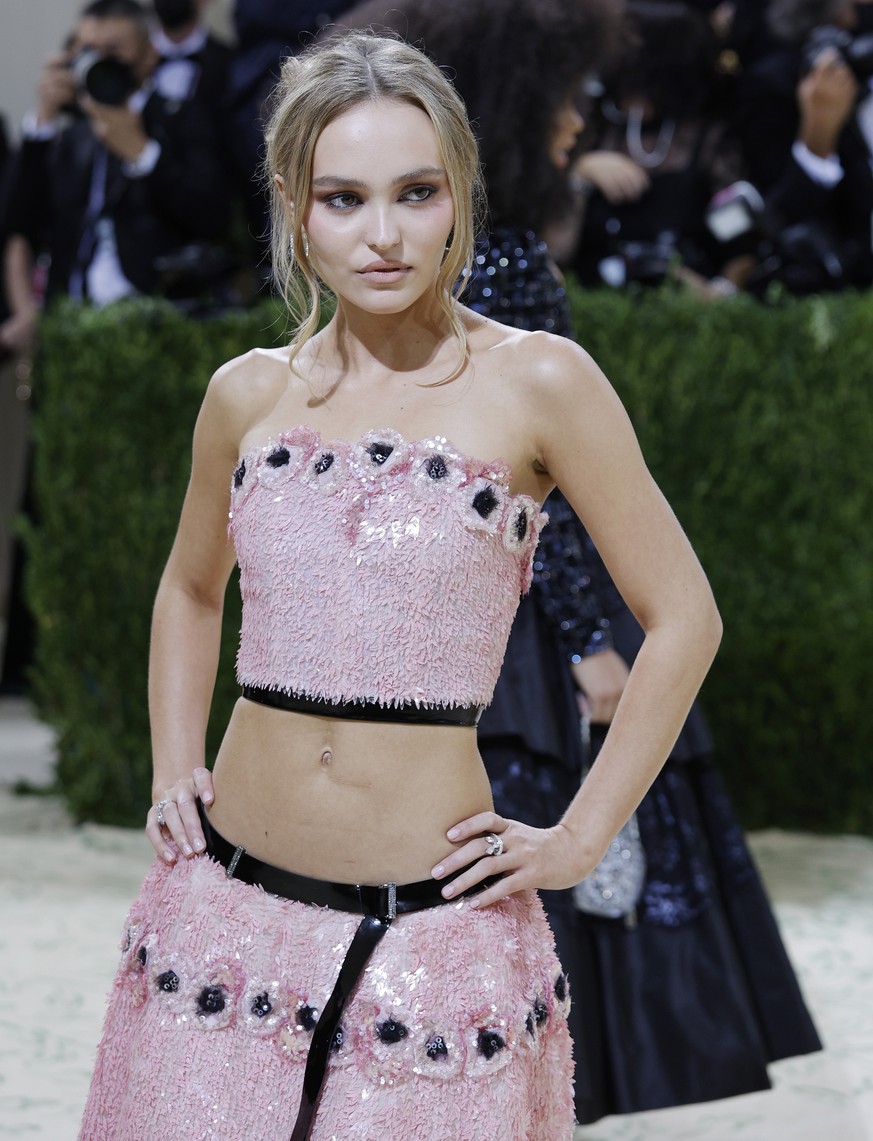 epa09466879 Lily-Rose Depp poses on the red carpet for the 2021 Met Gala, the annual benefit for the Metropolitan Museum of Art's Costume Institute, in New York, New York, USA, 13 September 2021. ...