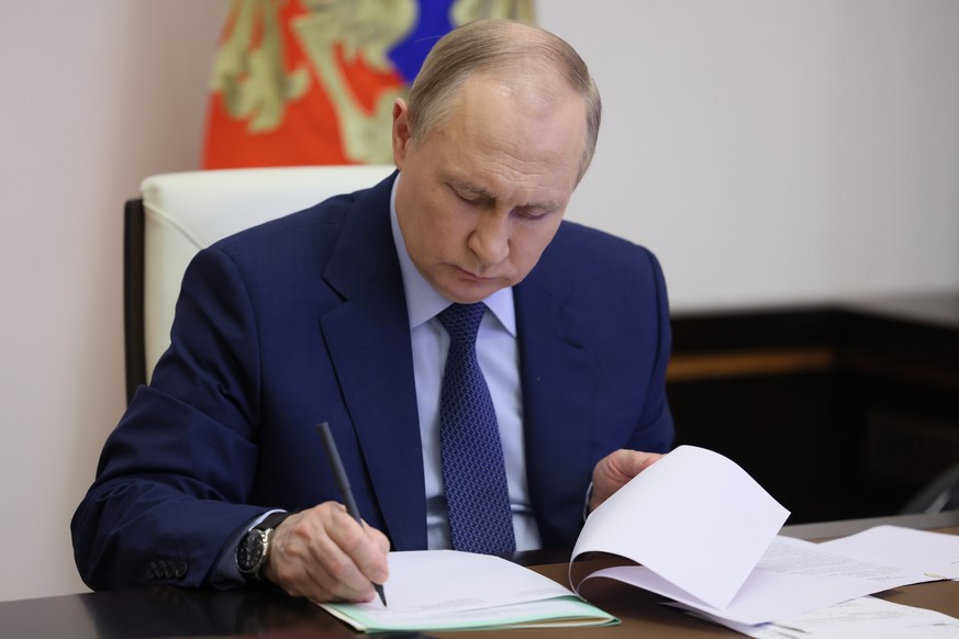 Russian President Vladimir Putin attends a meeting on the road construction development via videoconference at the Novo-Ogaryovo residence outside Moscow, Russia, Thursday, June 2, 2022. (Mikhail Metz ...