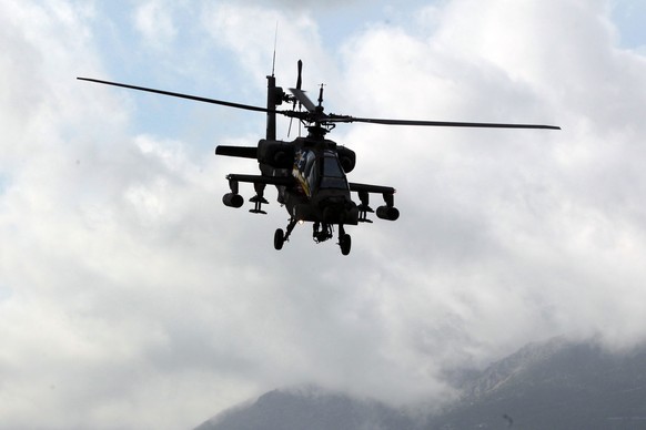 epa04420073 An AH-64A/D APACHE of Hellenic Army Aviation performs a formation flight during the 3rd Athens Flying Week 2014 (AFW) at Tatoi airport in northern Athens, Greece, 27 September 2014. EPA/PA ...