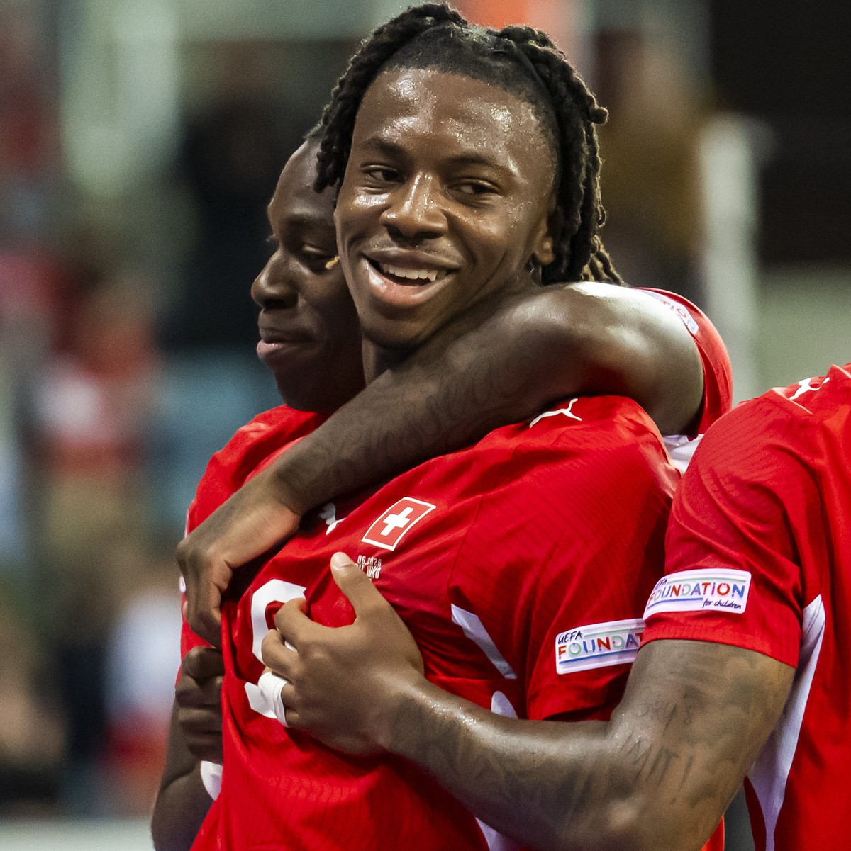 epa13285769 Switzerland's Johan Manzambi, centre, celebrates his 2-0 goal with teammates Switzerland's Winsley Boteli, left, and Switzerland's Sascha Britschgi, right, during the UEFA N ...