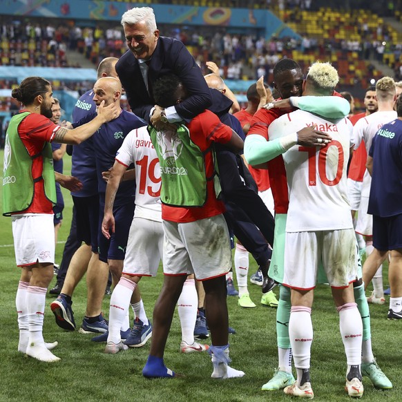 Switzerland&#039;s manager Vladimir Petkovic celebrates with his players end of the Euro 2020 soccer championship round of 16 match between France and Switzerland at the National Arena stadium, in Buc ...