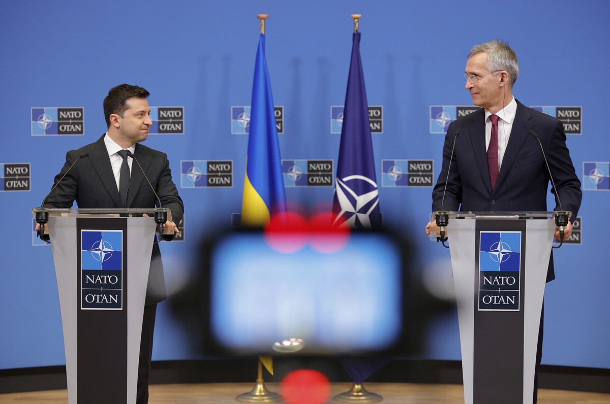 NATO Secretary General Jens Stoltenberg, right, and Ukraine's President Volodymyr Zelenskyy participate in a media conference at NATO headquarters in Brussels, Thursday, Dec. 16, 2021. (AP Photo/ ...