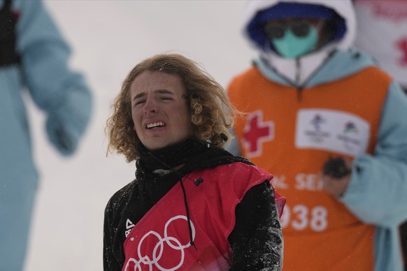 New Zealand's Ben Harrington after Harrington walks off the course after crashing into the edge of the course during the men's halfpipe qualification at the 2022 Winter Olympics, Thursday, Feb. 17, 2022, in Zhangjiakou, China. (AP Photo/Francisco Seco)
