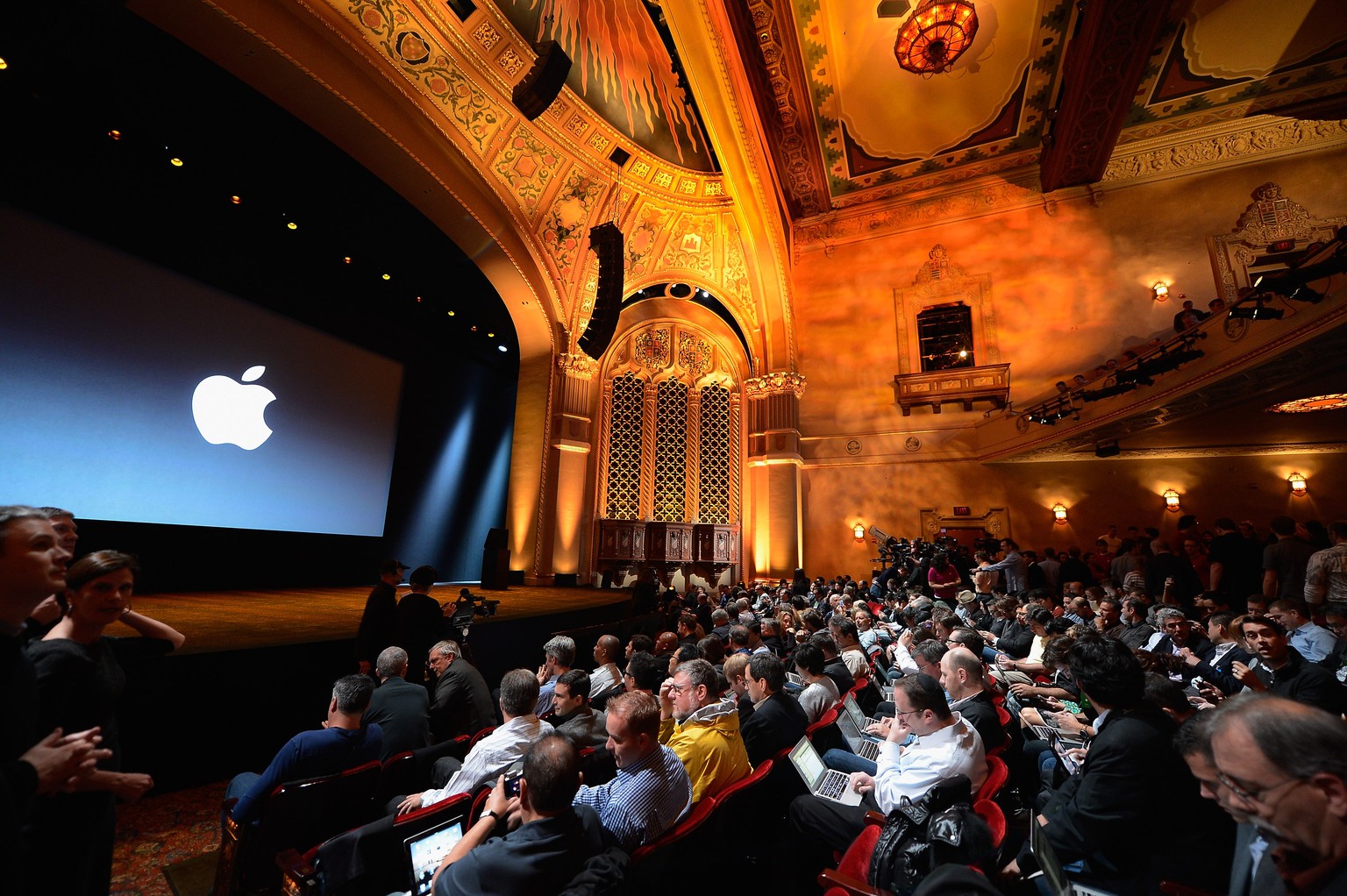 SAN JOSE, CA - OCTOBER 23: Tech reporters, bloggers and members of the news media wait for the start of an Apple special event at the historic California Theater on October 23, 2012 in San Jose, Calif ...