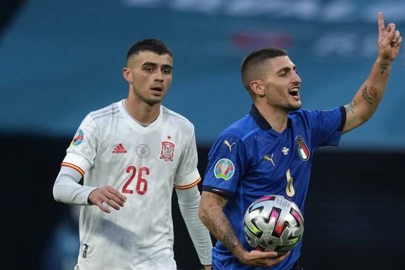 Italy&#039;s Marco Verratti, right, gestures past Spain&#039;s Pedri during the Euro 2020 soccer semifinal match between Italy and Spain at Wembley stadium in London, Tuesday, July 6, 2021. (AP Photo/ ...