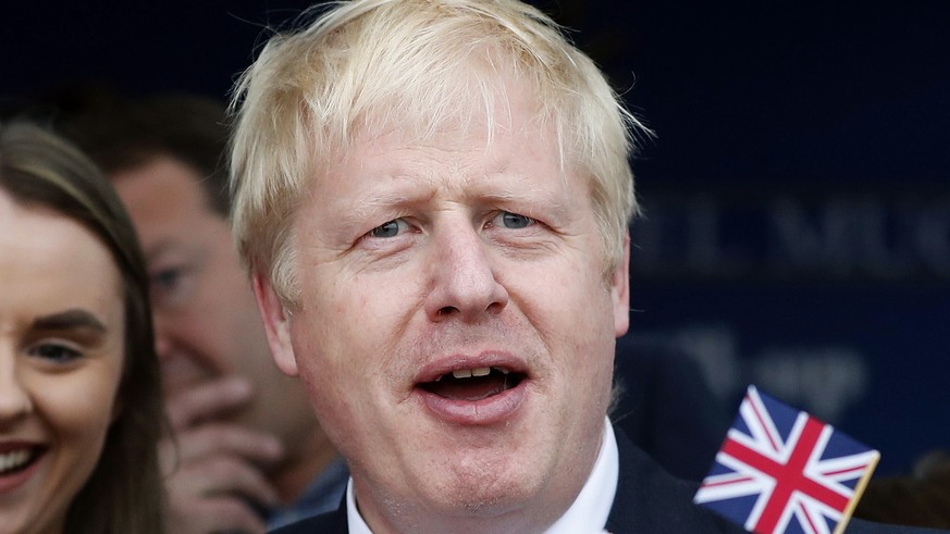 epa07699816 Conservative Party leadership candidate Boris Johnson eats an ice cream in Barry Island, Wales, Britain, 06 July 2019 ahead of the Conservative party leadership hustings in Cardiff. The tw ...