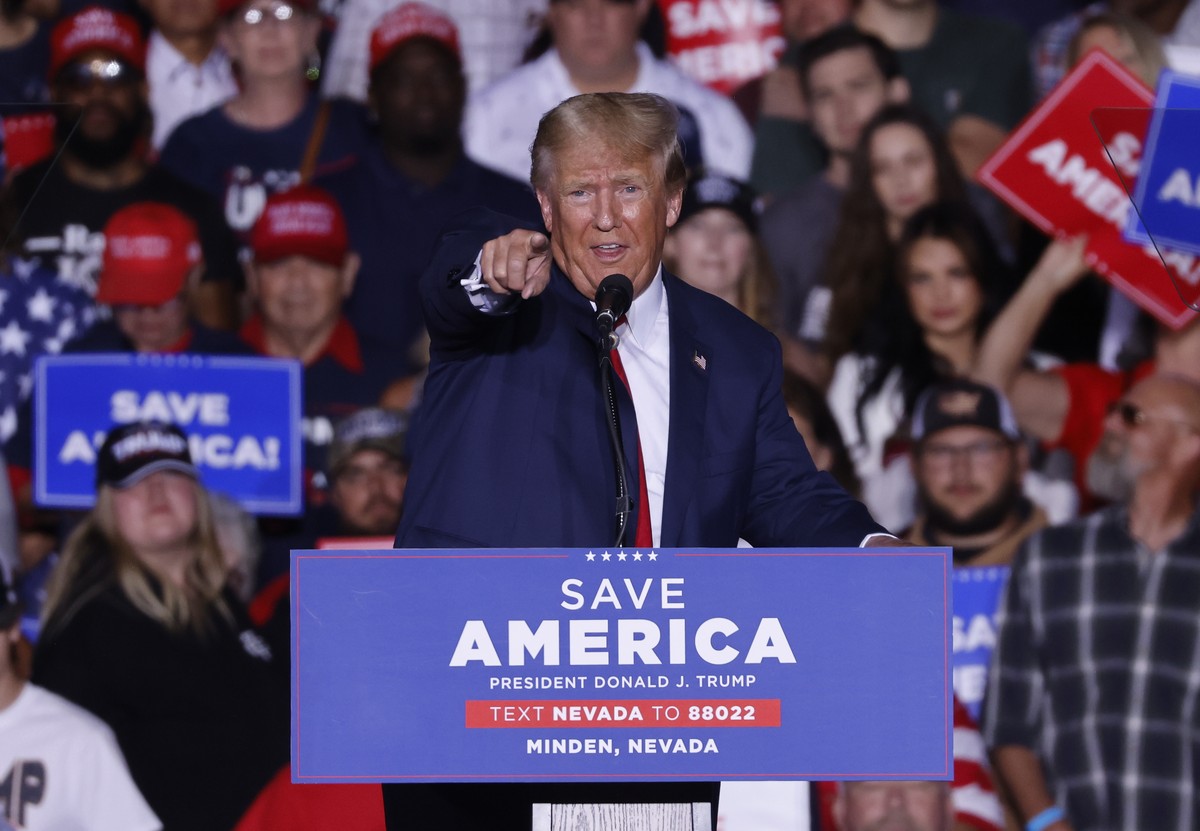 epa10232076 Former US President Donald J. Trump addresses supporters during the Save America rally at the Minden-Tahoe Airport in Minden, Nevada, USA, 08 October 2022. Trump is holding rallys for cong ...