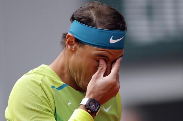 epa09984309 Rafael Nadal of Spain reacts as he plays Felix Auger-Aliassime of Canada in their men?s fourth round match during the French Open tennis tournament at Roland ?Garros in Paris, France, 29 M ...