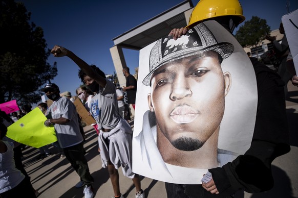 epa08489666 A portrait of Malcolm Harsch is carried during a protest in front of City Hall in Victorville, California, USA, 16 June 2020. Harsch, 38, was found hanging from a tree near a homeless enca ...