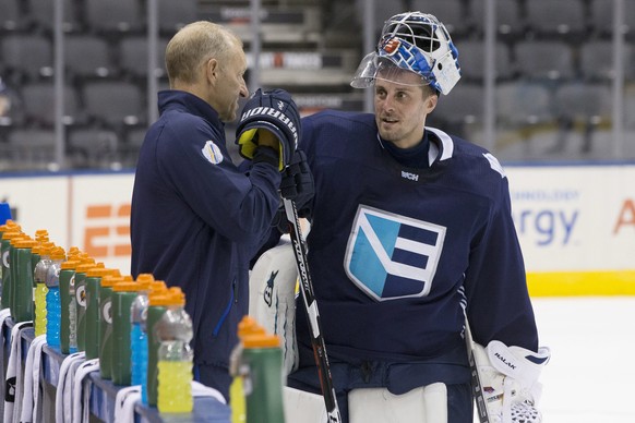 FILE - In this Sept. 23, 2016, file photo, Europe head coach Ralph Krueger, left, talks to goaltender Jaroslav Halak during practice at the World Cup of Hockey in Toronto. Canada plays Team Europe in  ...