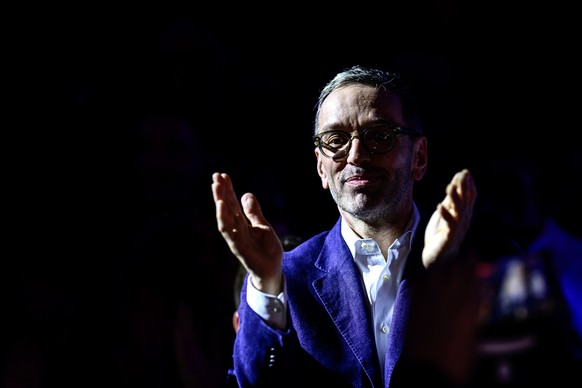 epa11153474 Herbert Kickl, leader of the right-wing Austrian Freedom Party (FPOe), claps as he attends the party&#039;s traditional political Ash Wednesday meeting in Ried im Innkreis, Austria, 14 Feb ...