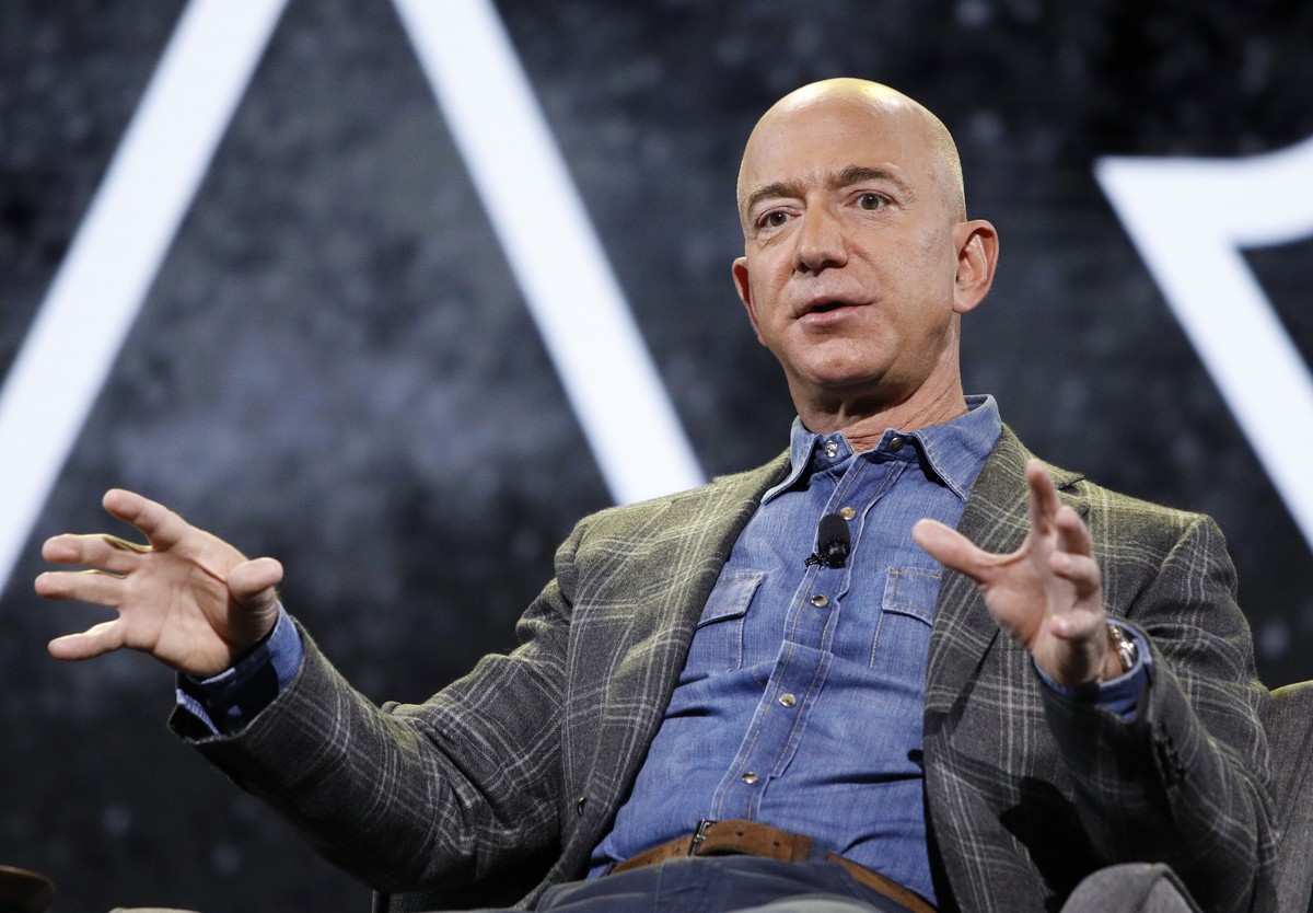 FILE - In this June 6, 2019 file photo, Amazon CEO Jeff Bezos speaks at the the Amazon re:MARS convention, in Las Vegas. Bezos will be aboard for Blue Origin's first human space flight next month ...