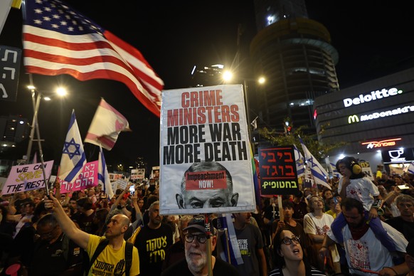 epa12089499 Families of Israeli hostages held by Hamas in Gaza and their supporters take part in a protest calling for the completion of a hostage deal between Israel and Hamas, outside the Kirya mili ...