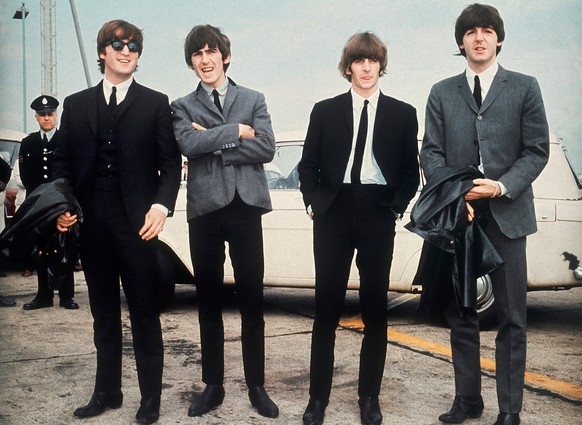 FILE - The Beatles, from left, John Lennon, George Harrison, Ringo Starr and Paul McCartney, arrive in Liverpool, England on July 10, 1964, for the premiere of their movie "A Hard Day's Nigh ...