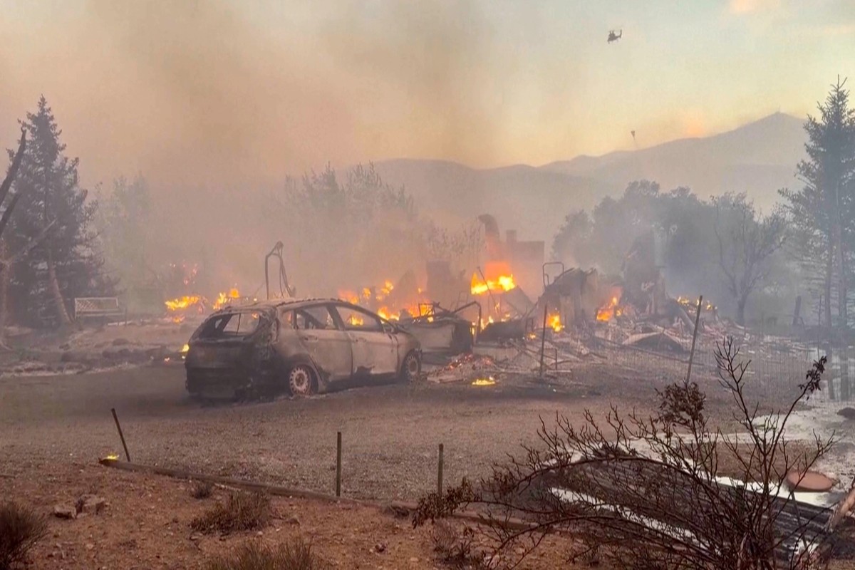 This image taken from video shows a charred neighborhood following wildfires Saturday, Aug. 22, 2026, in Reno, Nevada. (Tim Walton via AP)
Western Wildfires
