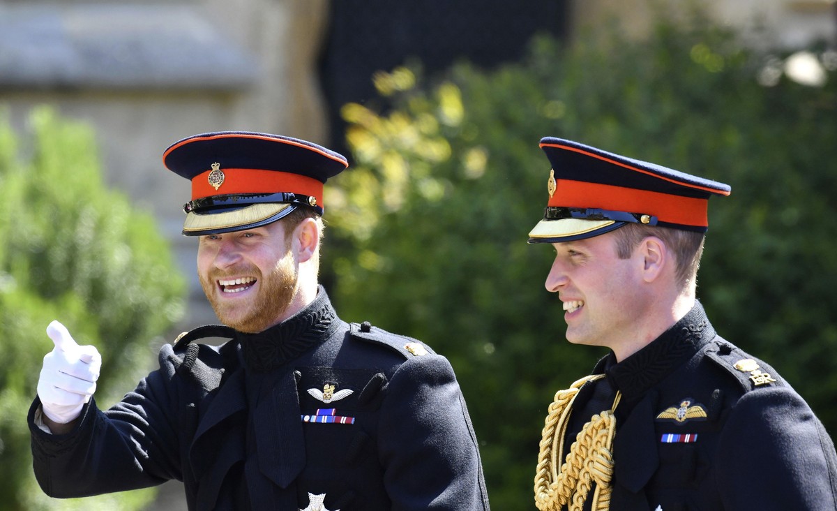 Britain's Prince Harry, left, reacts as he walks with his best man, Prince William the Duke of Cambridge, as they arrive for the the wedding ceremony of Prince Harry and Meghan Markle at St. Geor ...