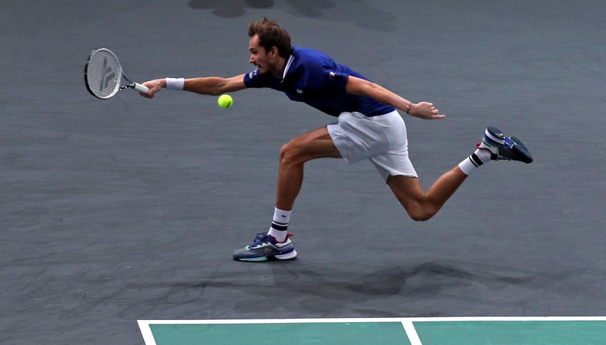 epa09569819 Daniil Medvedev of Russia in action during the final match against Novak Djokovic of Serbia at the Rolex Paris Masters tennis tournament in Paris, France, 07 November 2021. EPA/CHRISTOPHE  ...