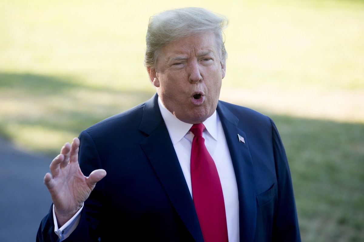 epa06877702 US President Donald J. Trump delivers remarks to members of the news media before departing the South Lawn of White House by Marine One, in Washington, DC, USA, 10 July 2018. Trump departs ...