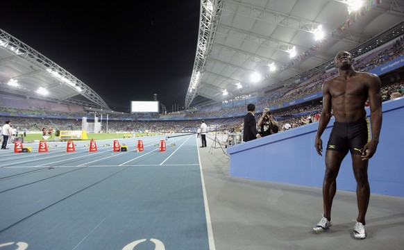 Jamaica's Usain Bolt reacts after being disqualified after a false start in the Men's 100m final at the World Athletics Championships in Daegu, South Korea, Sunday, Aug. 28, 2011. (AP Photo/ ...