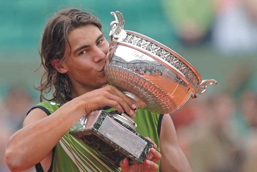 Tennis File Pictures Spain s Rafael Nadal defeats Argentina s Mariano Puerta, 6-7, 6-1, 6-4, 7-5 in their final of the French Tennis Open at Roland Garros arena in Paris, France on May 24, 2005. Photo ...