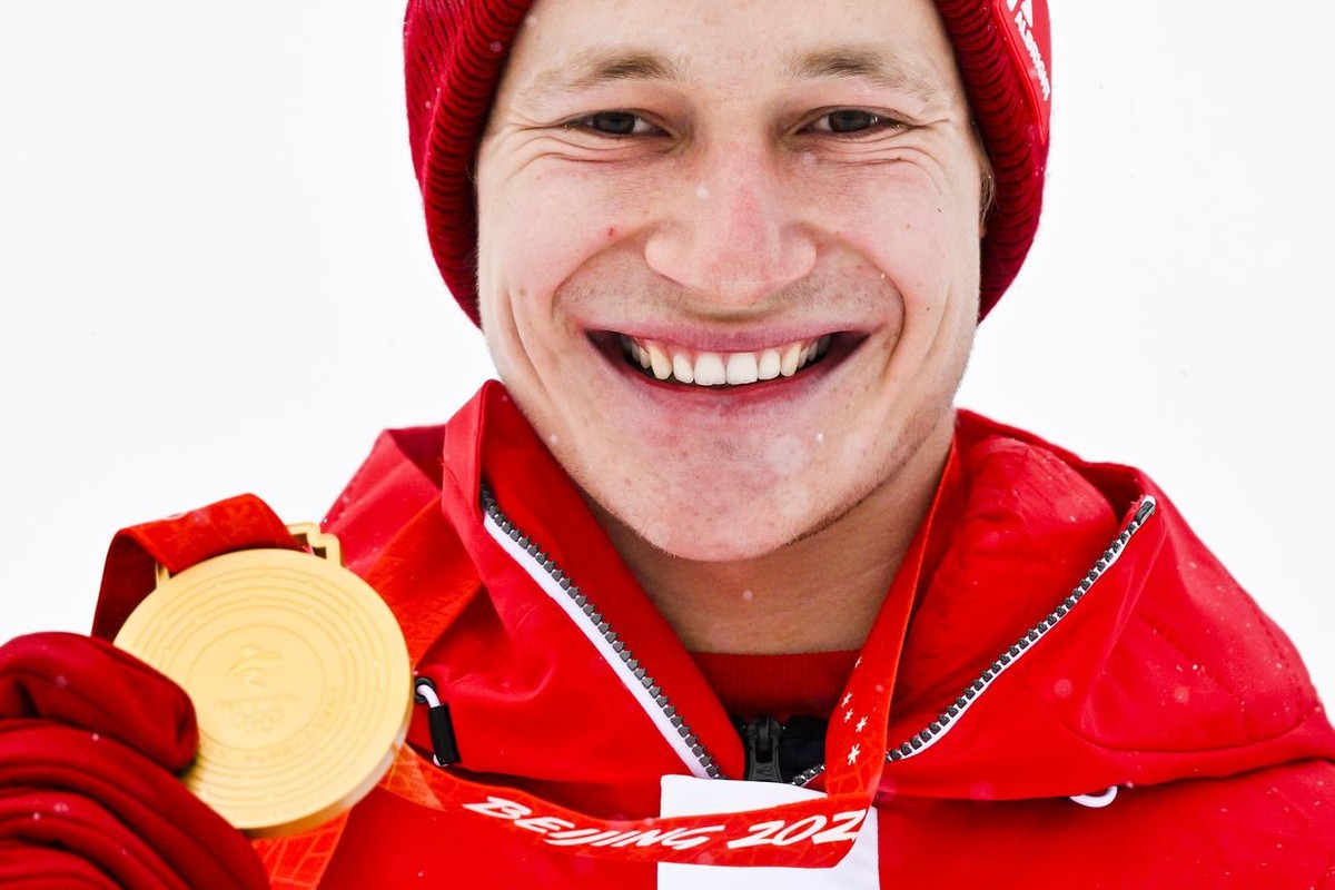 Gold medalist Marco Odermatt of Switzerland celebrates during the victory ceremony of the men's Alpine Skiing giant slalom race at the 2022 Olympic Winter Games in Yanqing, China, on Sunday, Febr ...