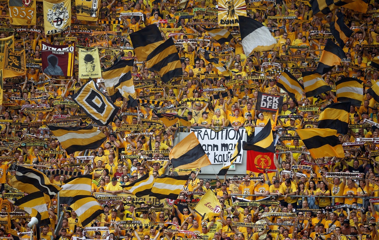 Football Soccer - Dynamo Dresden v RB Leipzig - German Cup (DFB Pokal) - DDV-Stadion, Dresden, Germany - 20/08/16. Dynamo Dresden&#039;s fans display banners and wave flags. REUTERS/Axel Schmidt DFB R ...