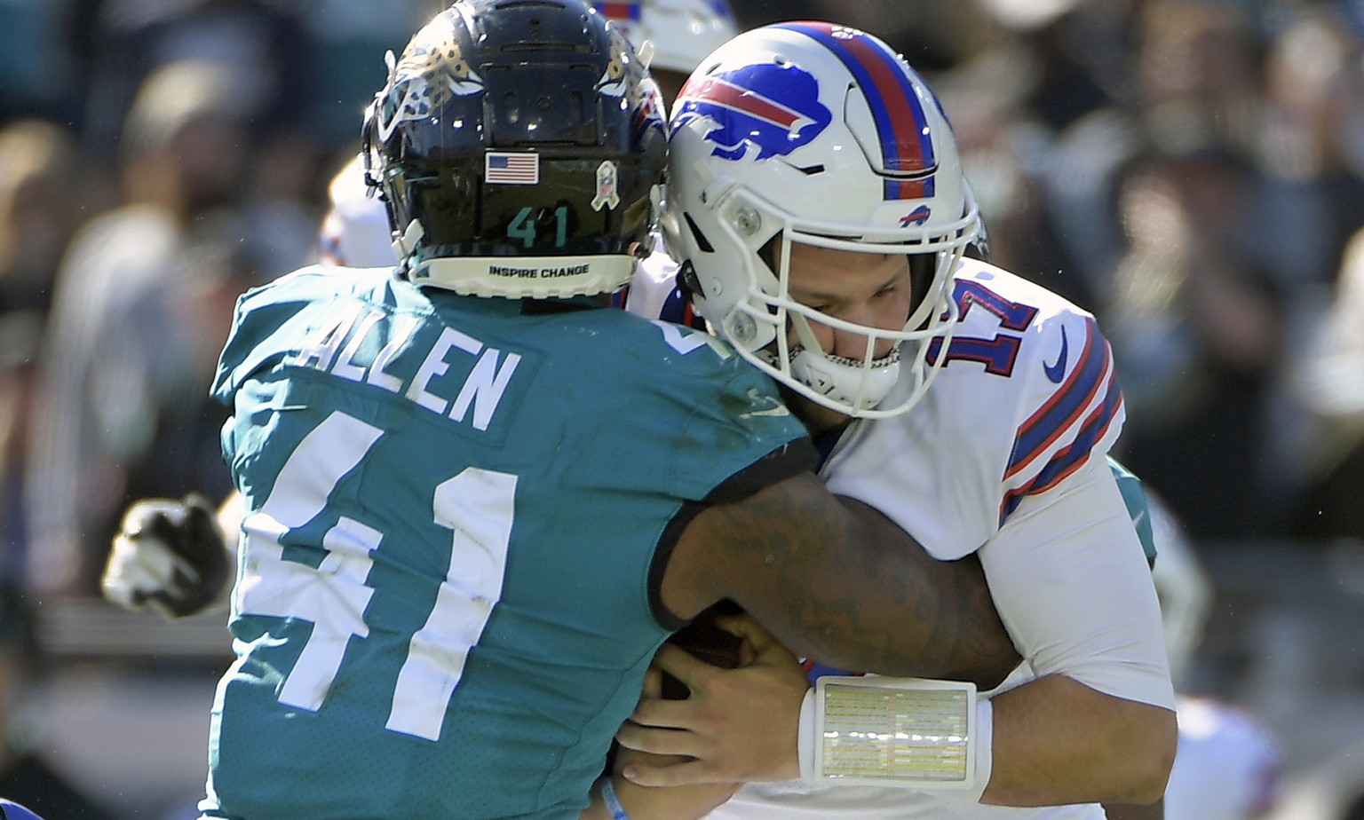 Jacksonville Jaguars linebacker Josh Allen (41) sacks Buffalo Bills quarterback Josh Allen (17) during the first half of an NFL football game, Sunday, Nov. 7, 2021, in Jacksonville, Fla. (AP Photo/Phe ...