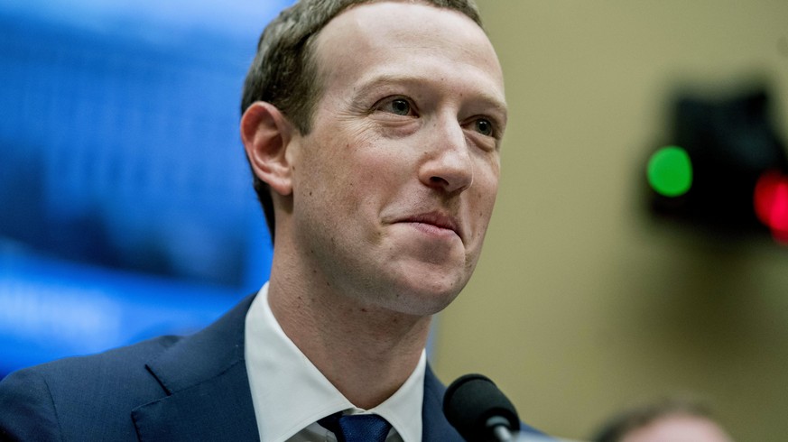 FILE- In this April 11, 2018 file photo, Facebook CEO Mark Zuckerberg pauses while testifying on Capitol Hill in Washington. Tech moguls Bill Gates and Zuckerberg are teaming up to help develop new te ...