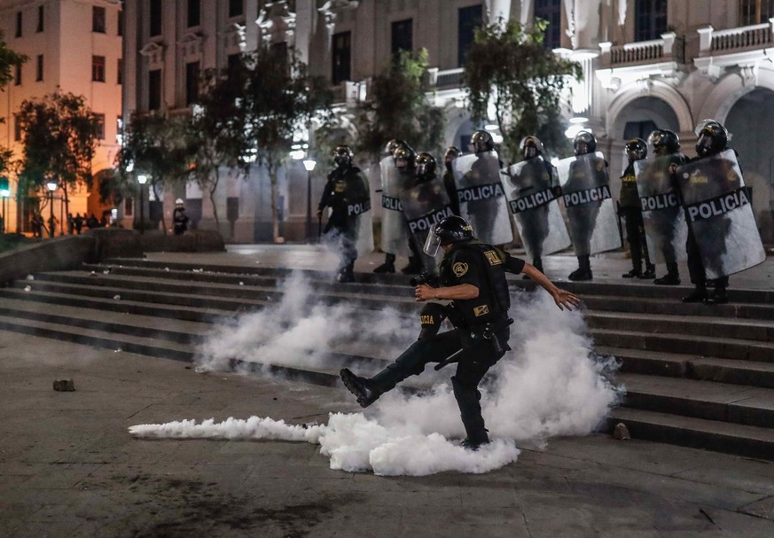 epa10361536 Police clash with demonstrators for Pedro Castillo and against Congress, in the streets of downtown Lima, Peru, December 11, 2022. The demonstrations, which have been repeated in ...