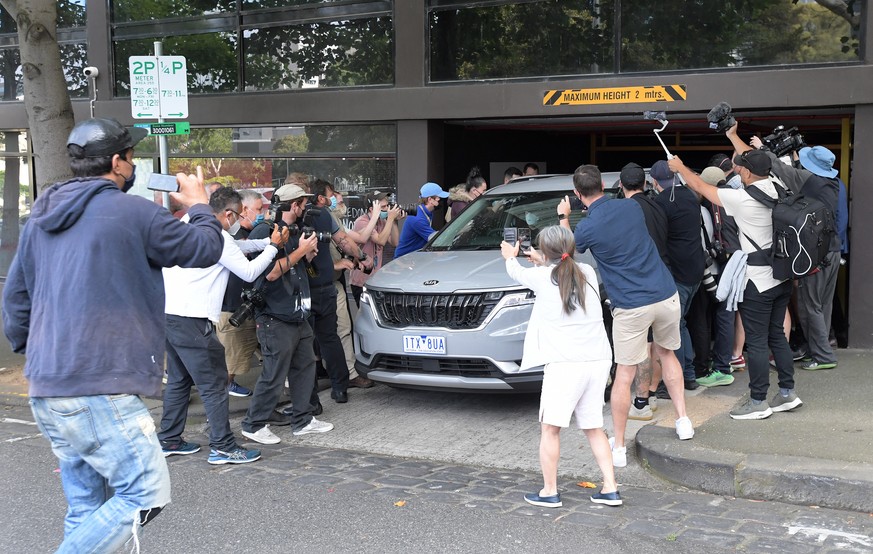 epa09688442 Serbian tennis player Novak Djokovic is photographed as he is transported from an Immigration Hotel in Melbourne, Australia, 16 January 2022. Novak Djokovic still faces uncertainty as to w ...