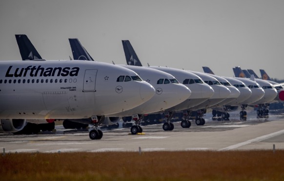 File- File picture taken June 3, 2020 shows Lufthansa aircrafts parking on a runway at the airport in Frankfurt, Germany. Lufthansa said Friday it has repaid all the German government aid it received  ...