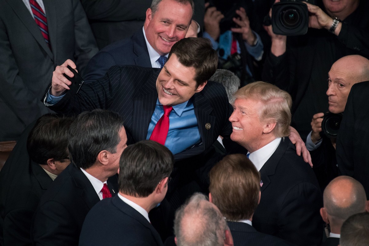 UNITED STATES - JANUARY 30: President Donald Trump takes a selfie with Rep. Matt Gaetz, R-Fla., in the House chamber after Trump's State of the Union address to a joint session of Congress on Jan ...