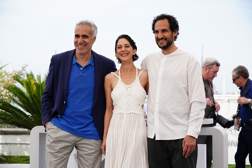 epa09968443 (LR) Mehdi Bajestani, Zar Amir Ebrahimi and director Ali Abbasi attend the photocall for 'Holy Spider' during the 75th annual Cannes Film Festival, in Cannes, France, May 23, 2022. The movement...