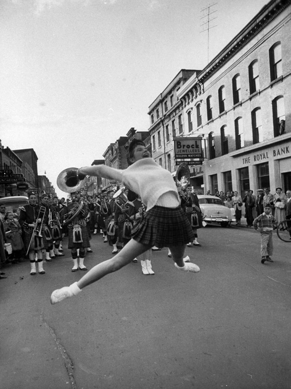 Cheerleaders parading prior to a football game between Queens College and the University of Toronto, 1954. (Lisa Larsen—The LIFE Picture Collection.)