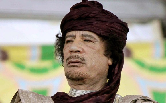 epa03728250 (FILE) A file photograph dated 06 October 2009, shows Muammar al-Gaddafi, leader of Libya, at the 50th anniversary of the founding of the officers group that mounted the Libyan Revolution  ...
