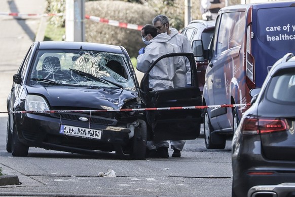 epaselect epa11938058 Police investigators check a damaged car at the scene after a vehicle was driven to pedestrians in Mannheim, Germany, 03 March 2025. According to statements from police, a vehicl ...