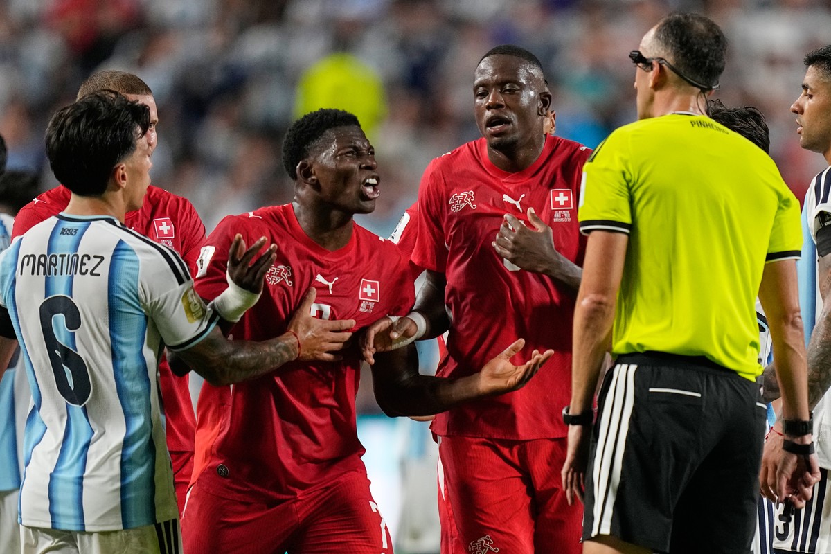 Switzerland's Breel Embolo (7) remonstrates with referee Joao Pinheiro, of Portugal after he was given a red card during the World Cup quarterfinal soccer match between Argentina and Switzerland  ...