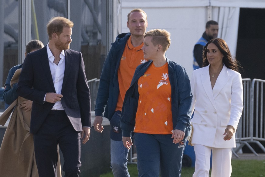 Prince Harry and Meghan Markle, Duke and Duchess of Sussex, arrive at the Invictus Games venue in The Hague, Netherlands, Friday, April 15, 2022. The week-long games for active servicemen and veterans ...